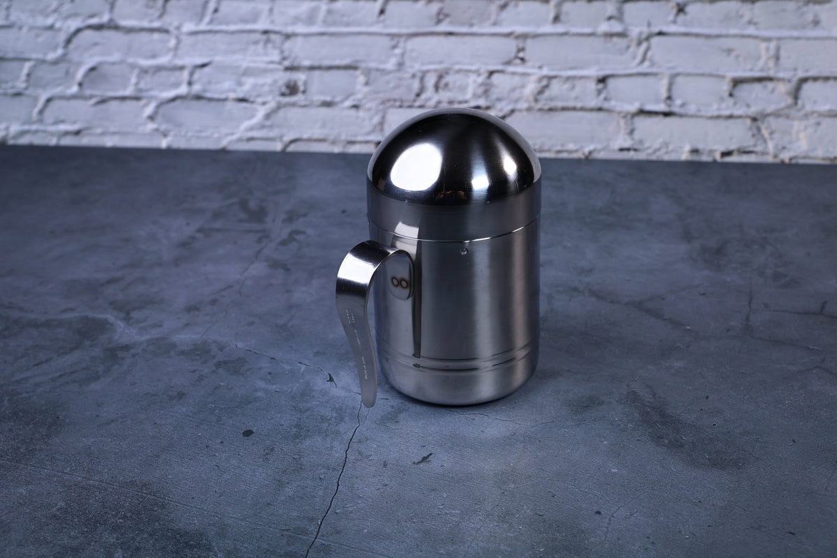 Stainless steel oil cruet small — side view from handle side showing brushed and polished stainless finish