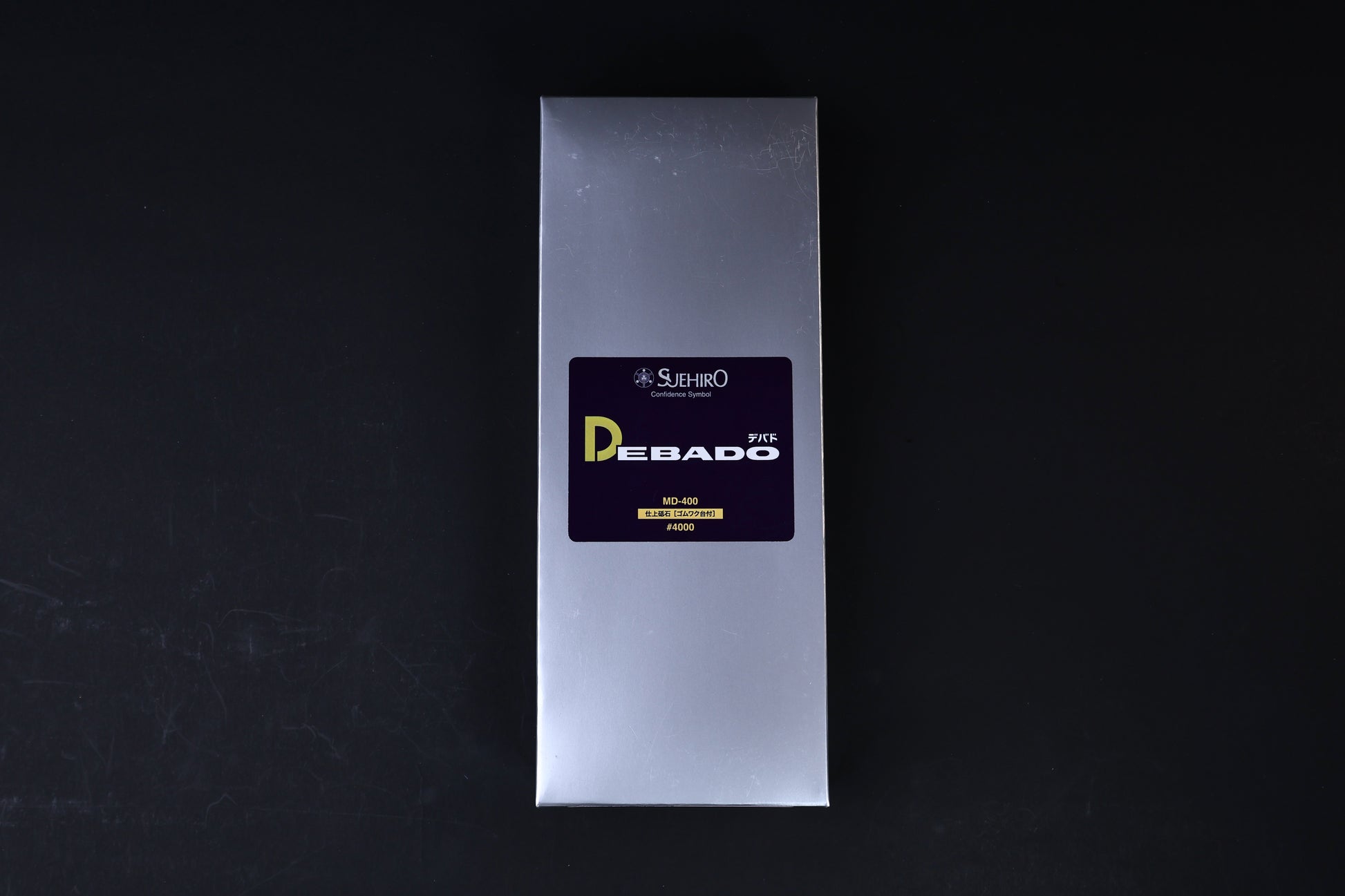 Suehiro Debado MD-400 #4000 sharpening stone — silver retail box with Debado label front view