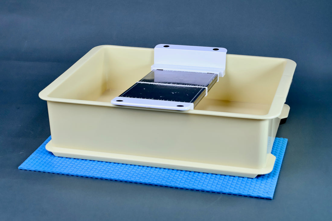 Suehiro multi sliding rack stone holder — installed in soaking tray with blue silicon non-slip mat