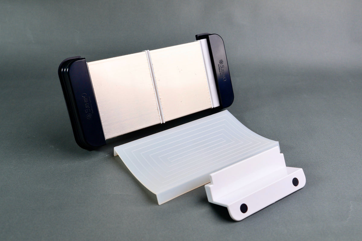 Suehiro multi sliding rack stone holder — disassembled view showing holder, silicon mat, and tray bracket components