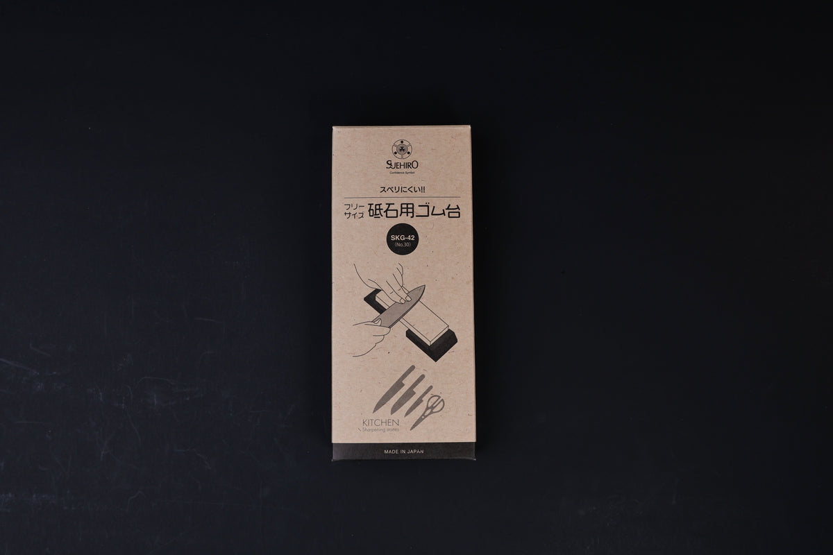 Suehiro rubber whetstone base SKG-42 packaging, kraft paper box with Japanese text and sharpening illustration