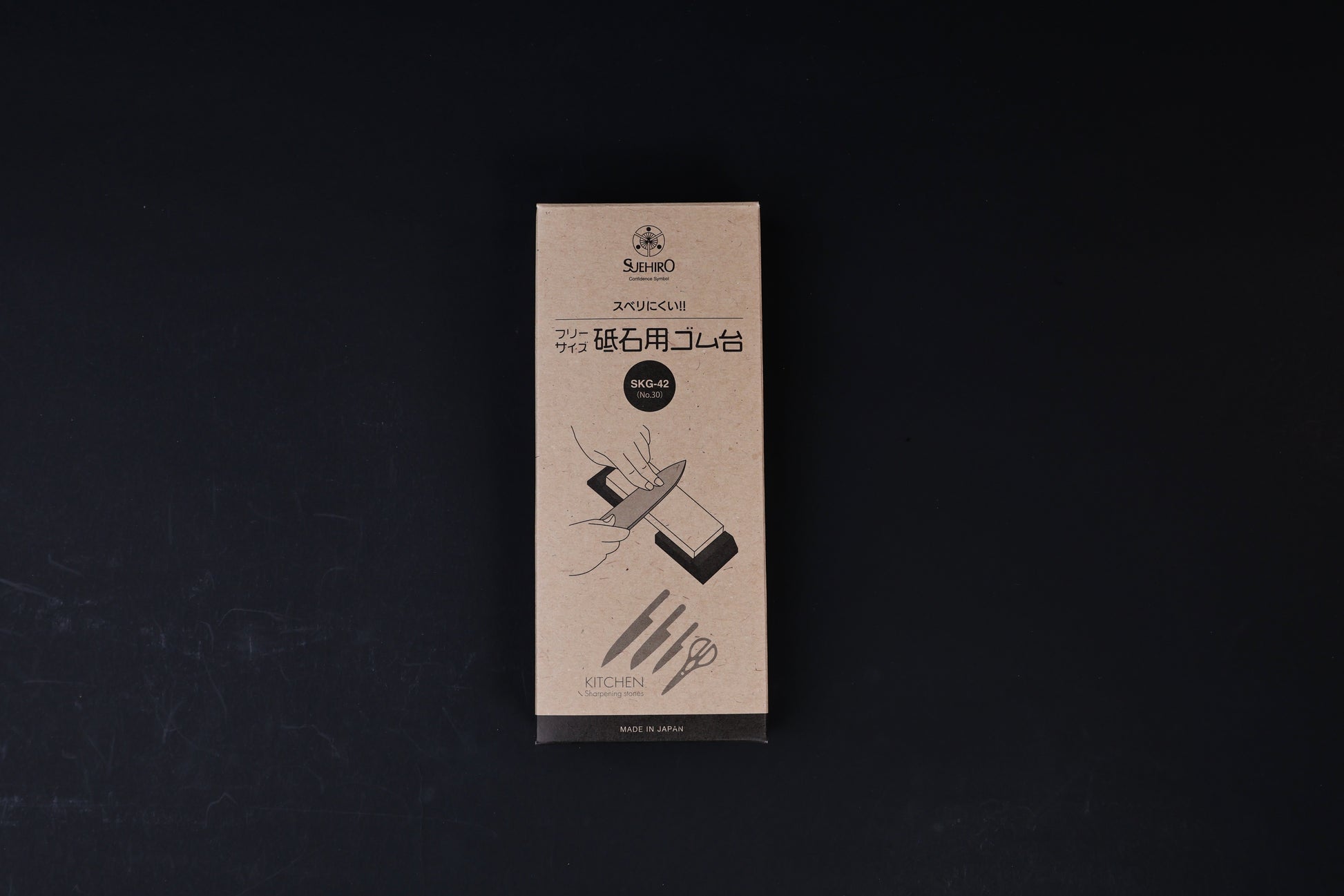Suehiro rubber whetstone base SKG-42 packaging, kraft paper box with Japanese text and sharpening illustration