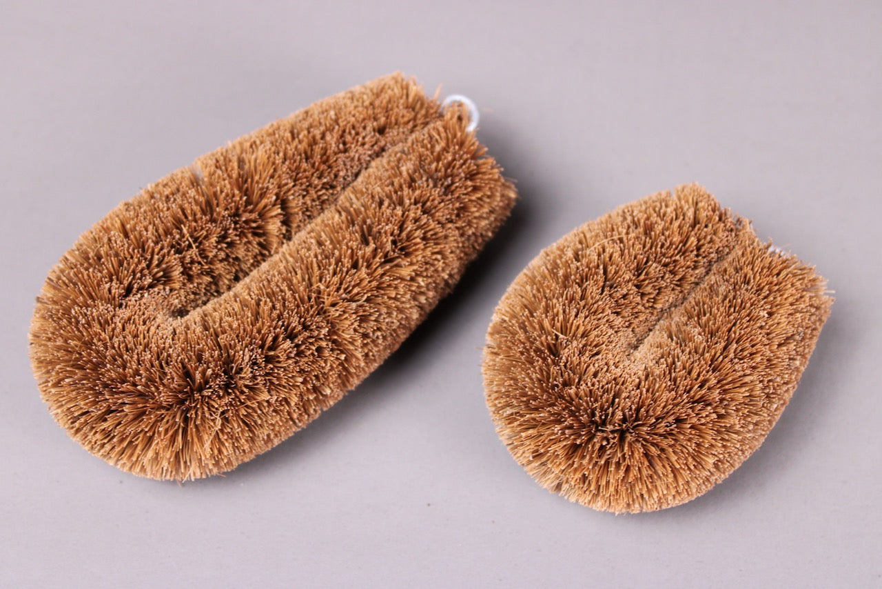 tawashi natural scrubber with brownish spiked texture showing 2 sizes with grey background