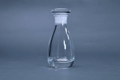 THE soy sauce cruet crystal glass full profile view with stopper on grey background
