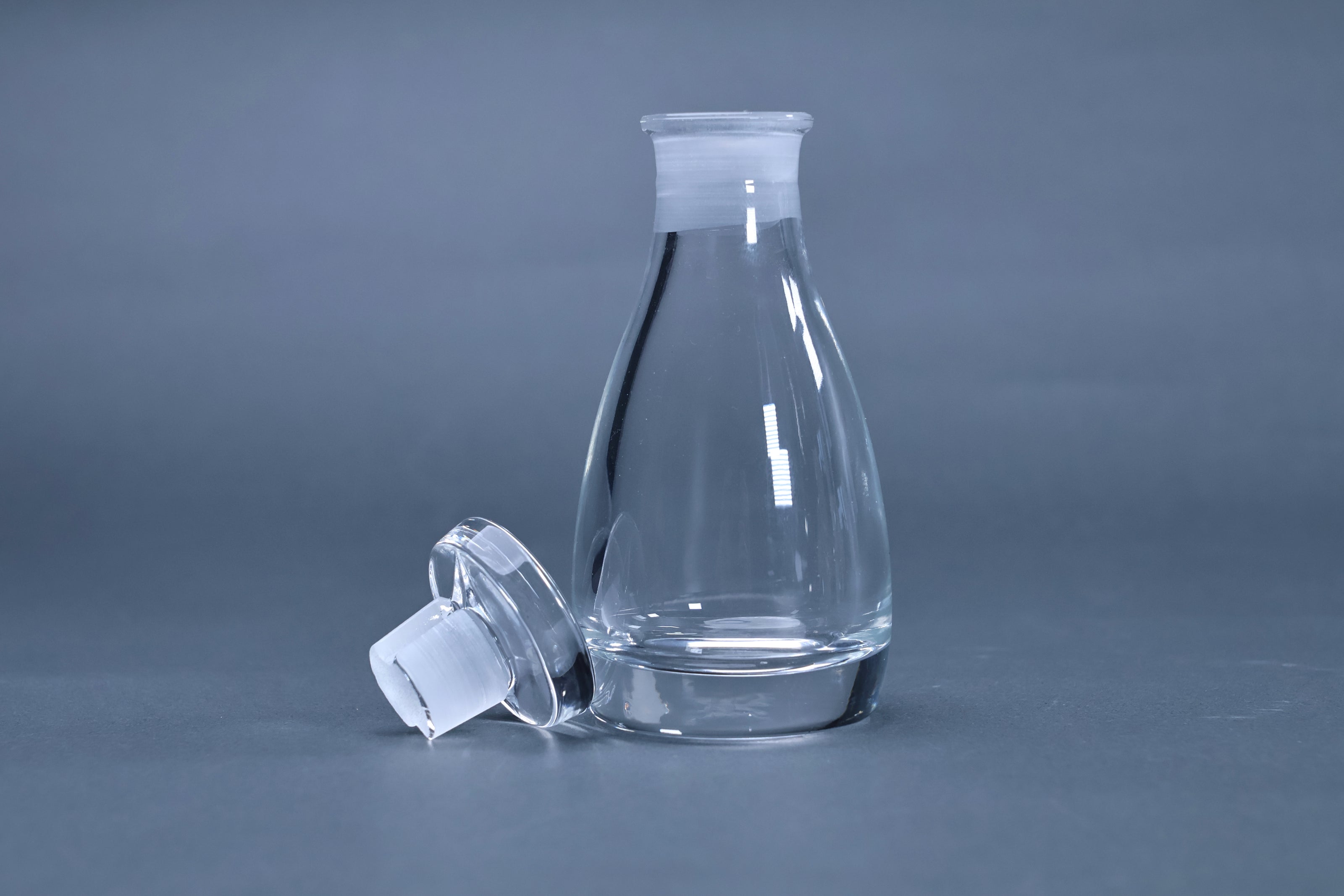 THE soy sauce cruet crystal glass body and stopper separated showing spout-free neck design