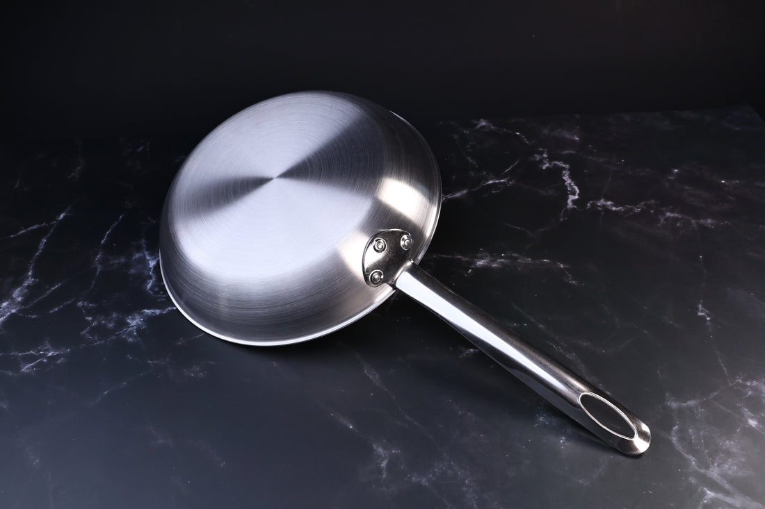 Torino stainless clad frying pan 24cm — exterior base showing clad construction and riveted handle