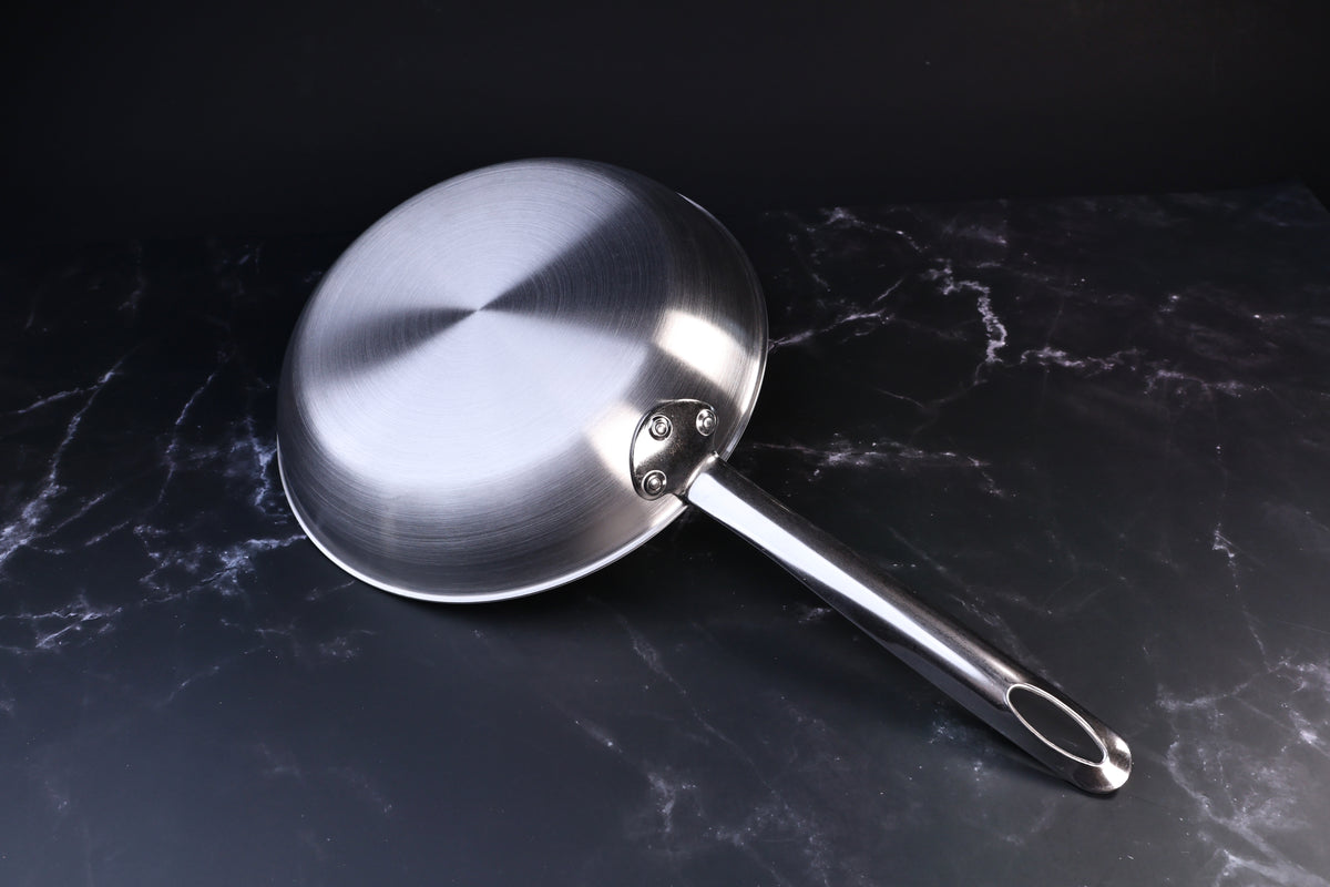 Torino stainless clad frying pan 24cm — exterior base showing clad construction and riveted handle