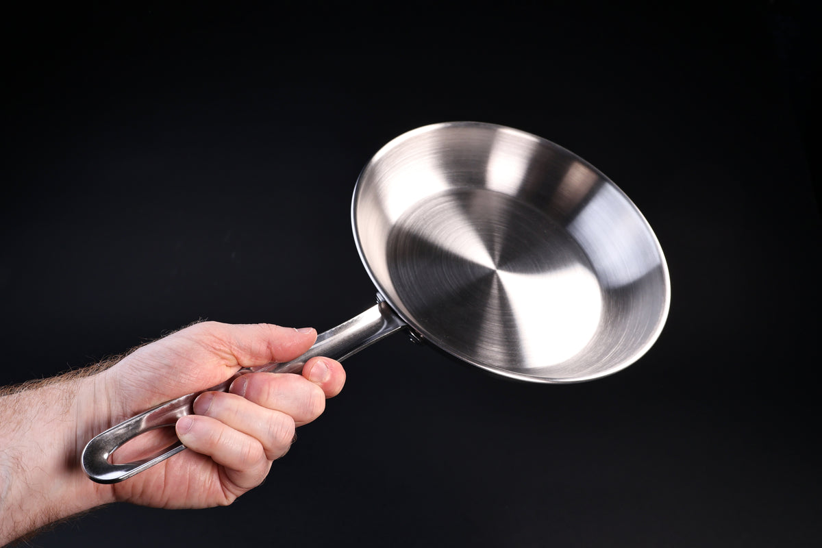Torino stainless clad frying pan 24cm — handle grip and weight shown held in hand