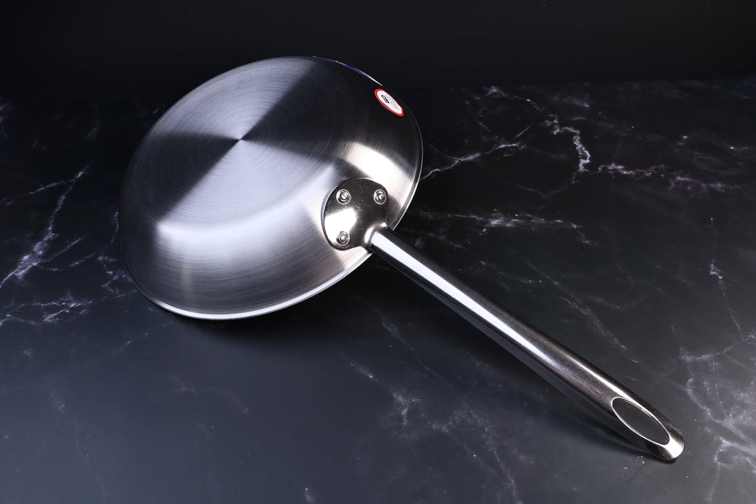 Torino stainless clad frying pan 26cm — exterior base, riveted handle attachment, and brand label