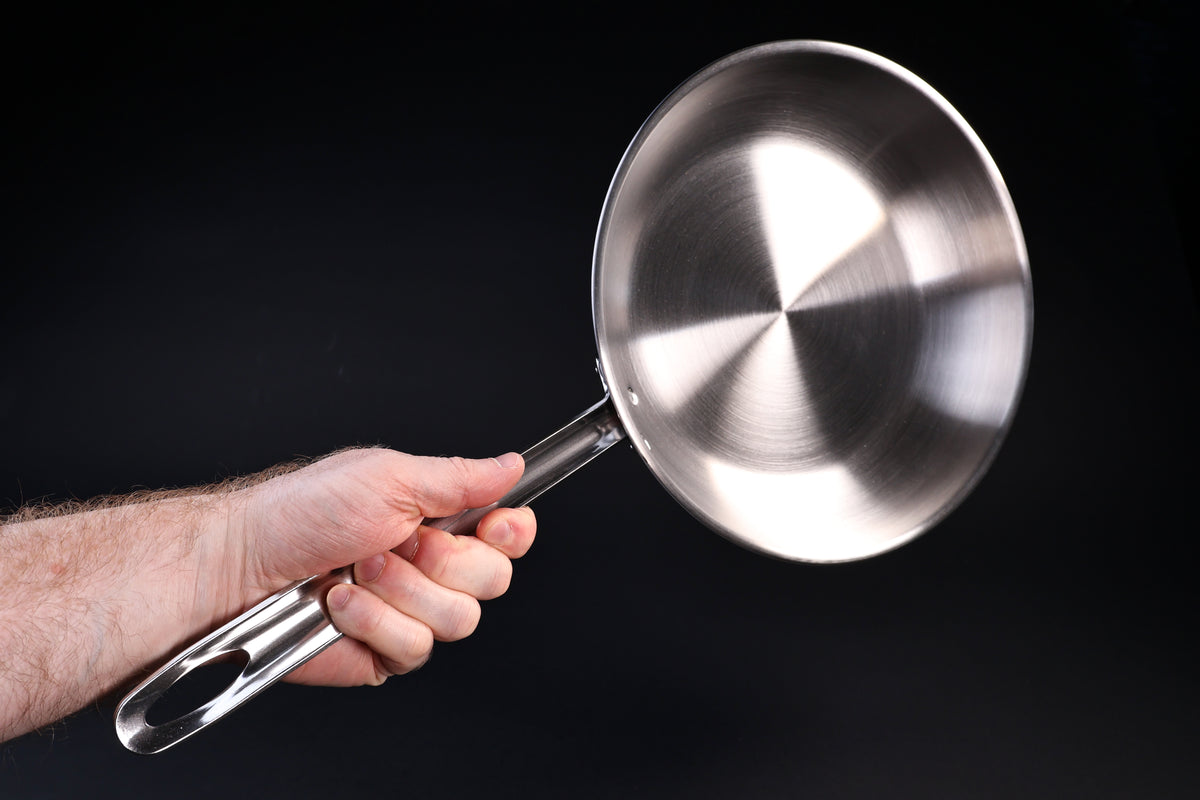 Torino stainless clad frying pan 26cm — handle grip and pan weight shown held in hand