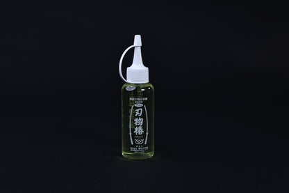 Tsubaki oil for knives and iron pans 100ml — full upright view of bottle, label, and precision applicator tip