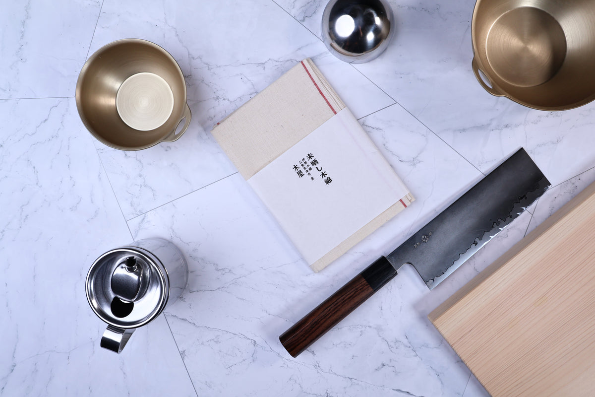Unbleached cotton cloth pack of 3 — folded cloths with Japanese knife and kitchen tools flat lay