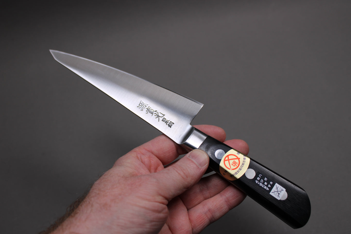 nihonko carbon steel knife made in japan held upside down 