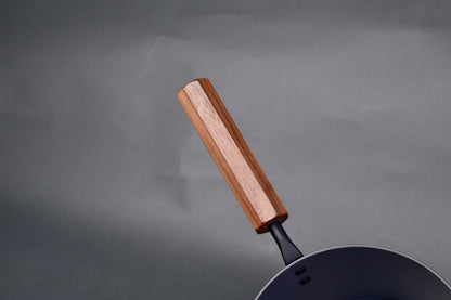 octagonal deep brown wood handle for iron saucepan in light grey background