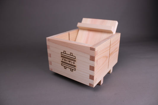 hinoki wood iroha sandwich maker by yamacoh japan with name imprinted on wood made of 3 pieces with grey background