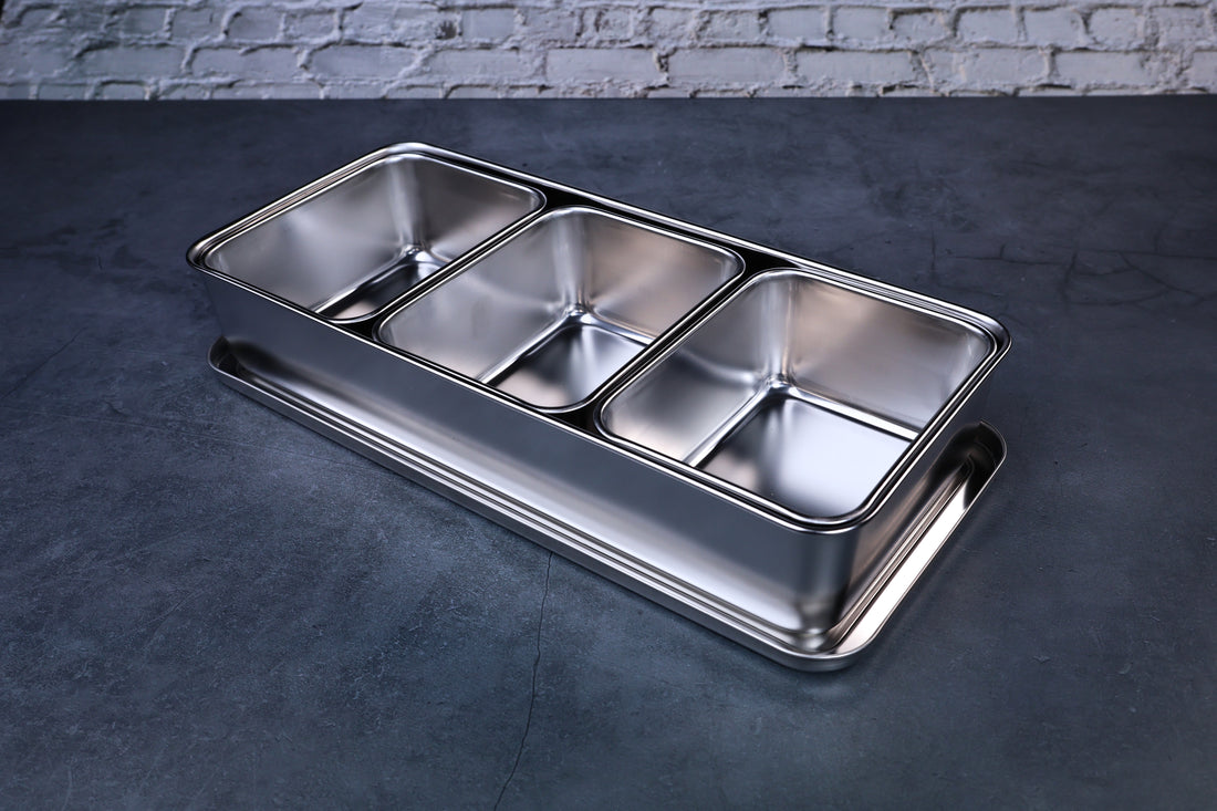 Yakumi 3-compartment condiment pan — angled overhead view showing all three stainless steel compartments