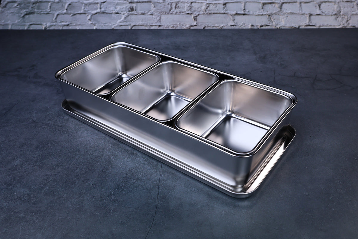 Yakumi 3-compartment condiment pan — angled overhead view showing all three stainless steel compartments