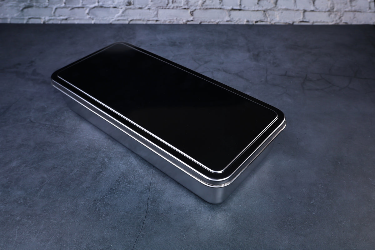 Yakumi 3-compartment condiment pan — closed with black lid showing full profile