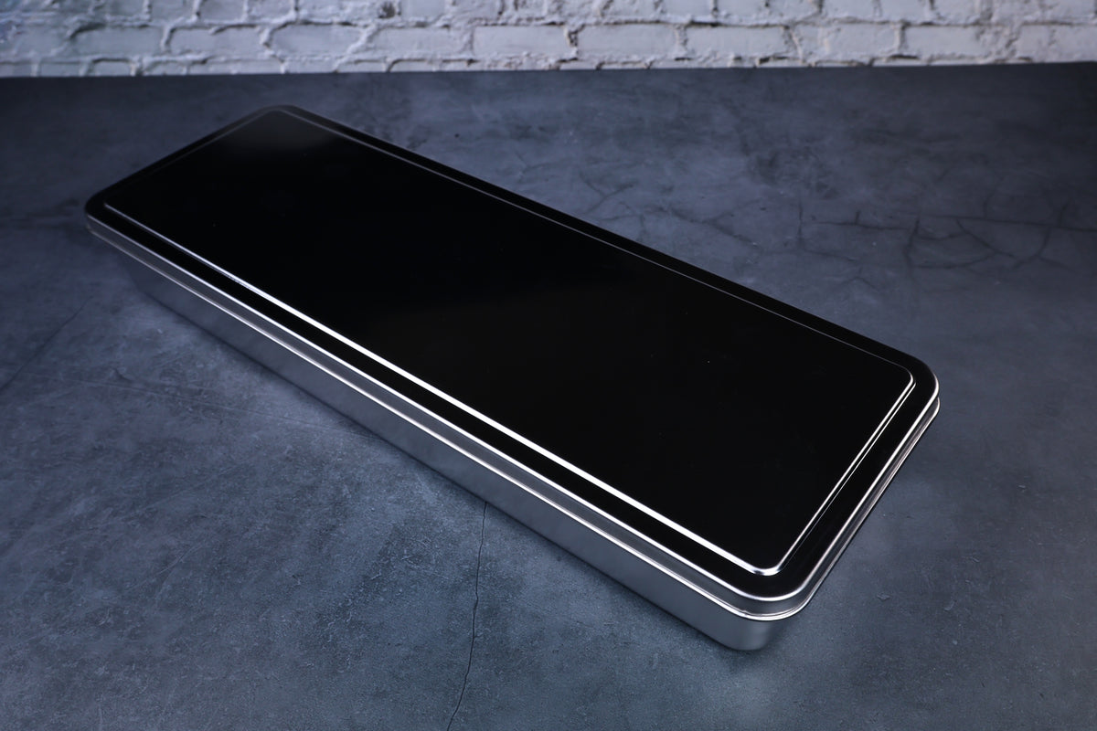 Yakumi 4-compartment condiment pan — closed with black lid showing full profile