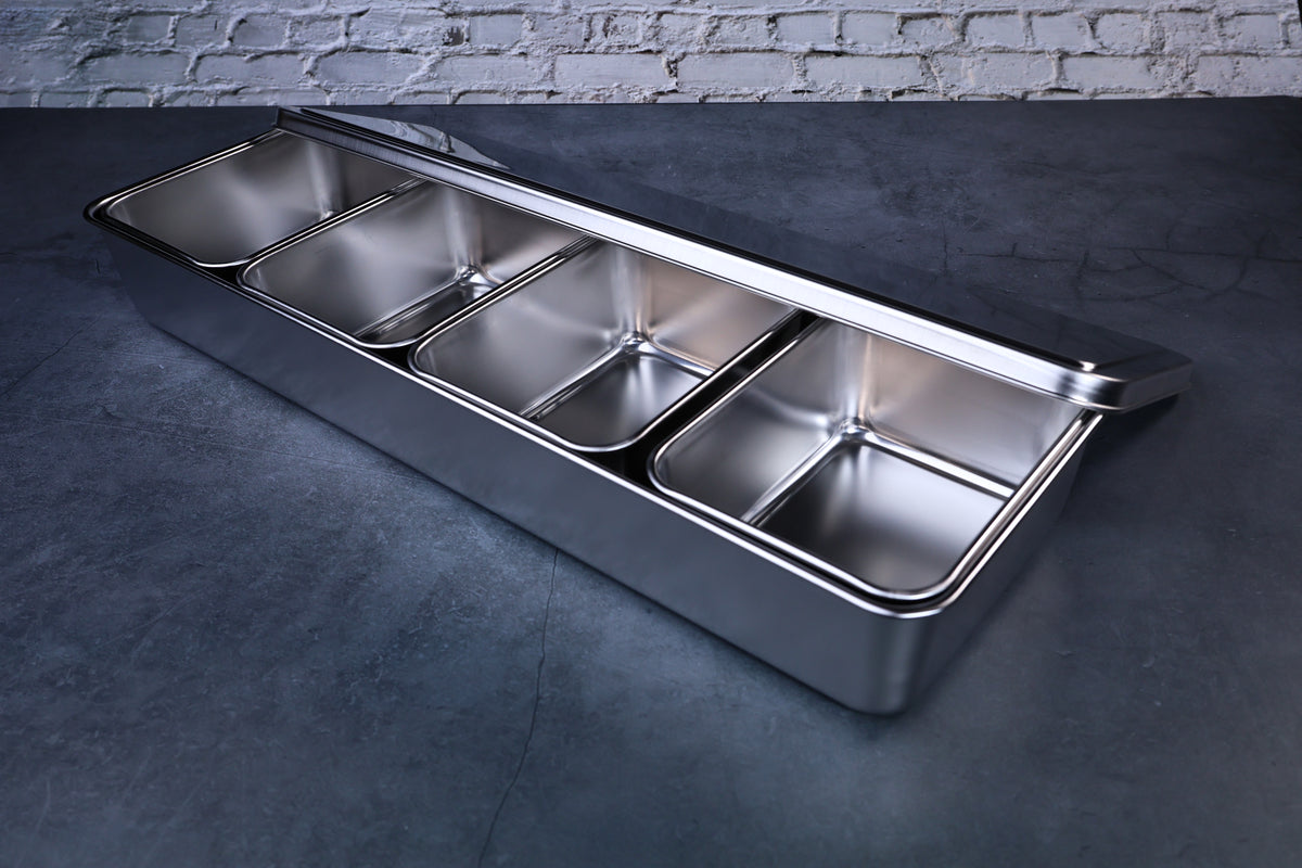 Yakumi 4-compartment condiment pan — angled view showing compartments and lid detail