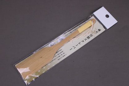 yakumiyose bamboo brush for oroshigane condiment packed with brand name and product miyabitake with grey background