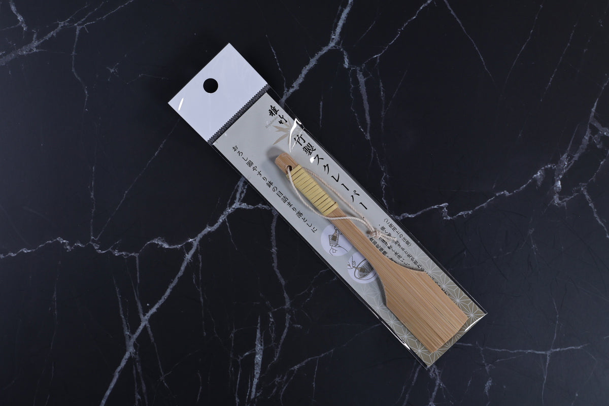 Yakumiyose bamboo brush 13cm — full product in Japanese packaging, top view on dark marble