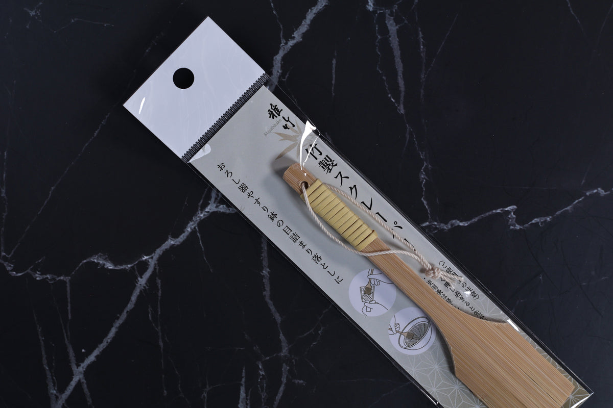 Yakumiyose bamboo brush 13cm — close-up in packaging showing bamboo bristle head and wrapped handle detail