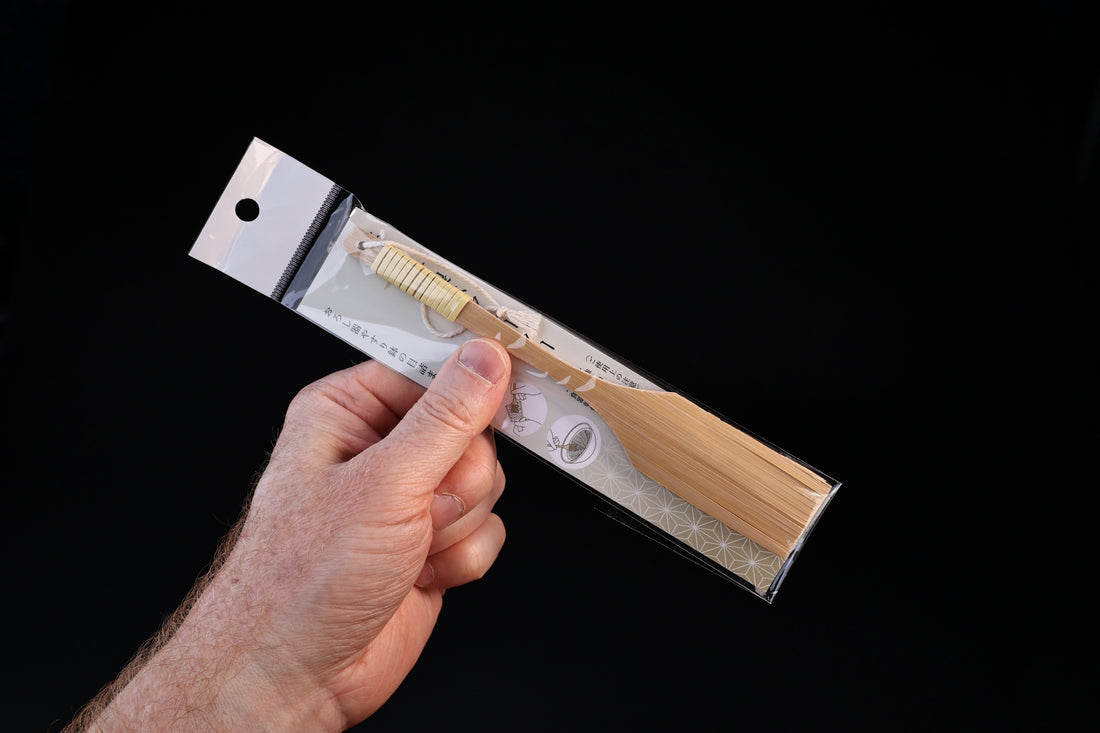 Yakumiyose bamboo brush 18cm — hand holding packaged brush showing full length and scale
