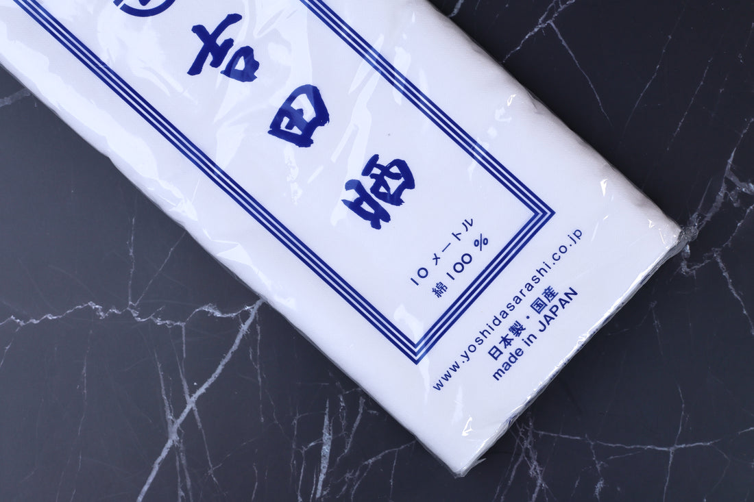 Yoshida Sarashi kitchen towel — close-up of packaging label showing Made in Japan and 100% cotton details