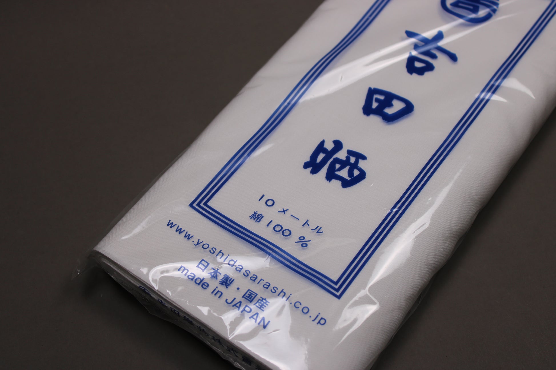 package showing yoshida sarashi towel  logo brand describing items