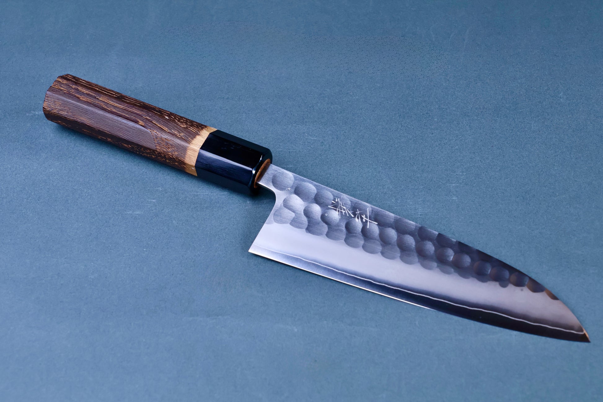 Yoshikane SKD Tsuchime nakiri 165mm full profile on grey background showing burnt chestnut handle and tsuchime blade