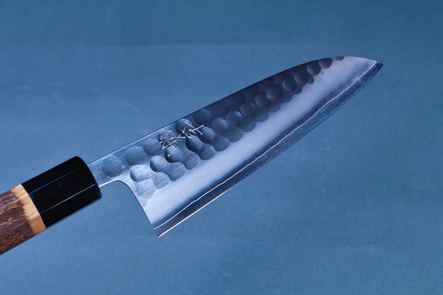 Yoshikane SKD Tsuchime Santoku 165mm three-quarter view showing tsuchime blade, kanji and handle junction