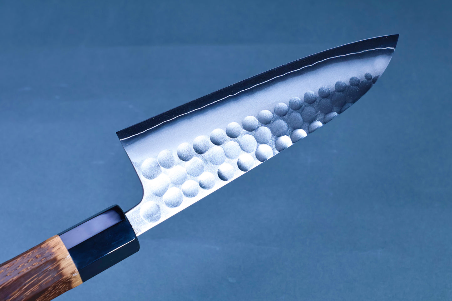 Yoshikane SKD Tsuchime Santoku 165mm blade tip showing hammered finish and fine cutting edge