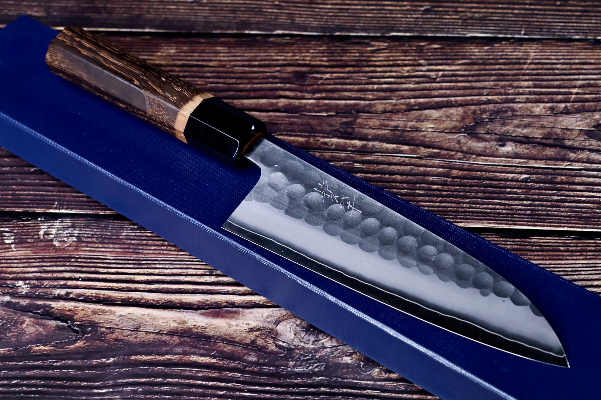 Yoshikane SKD Tsuchime Nakiri 165mm three-quarter view on navy cloth showing blade tip and handle junction