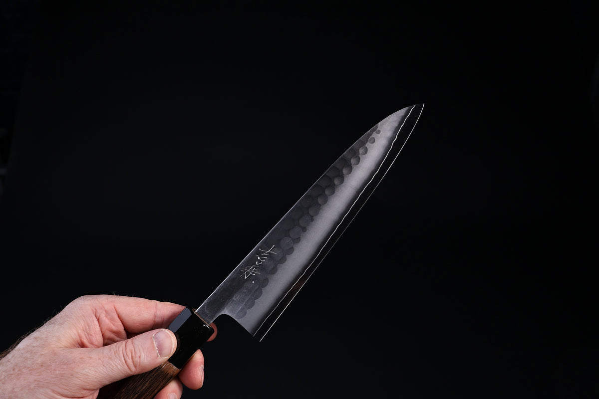 Tsuchime hammered finish detail on Yoshikane SKD Gyuto 210mm blade face